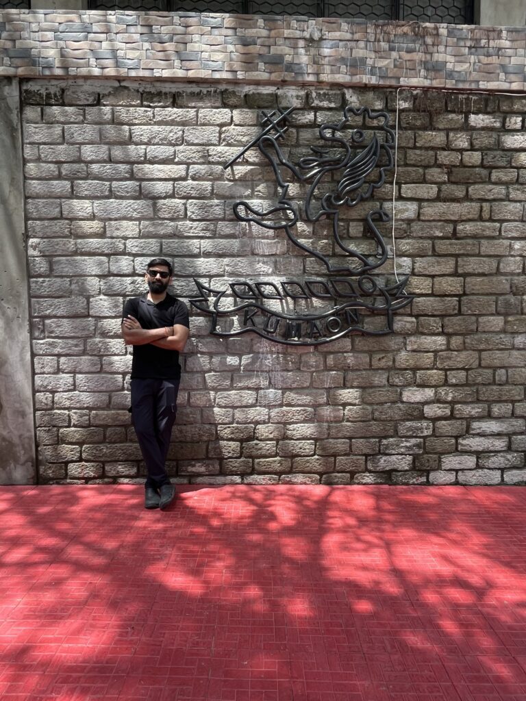 A young man standing in front of Kumaon Museum, best places to visit in Ranikhet, Uttarakhand